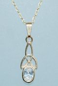 A vintage 9ct gold pendant necklace strung with a pendant set with an oval cut CZ in a celtic knot.