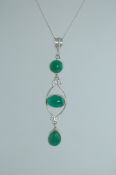 A 925 silver pendant necklace strung with an Art Nouveau emerald glass cabochon pendant on a silver