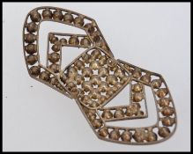 A Victorian white metal buckle set with paste stones in pierced setting. Measures 8cms x 3.