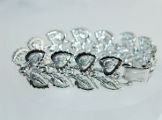 An early Jewelcraft Coro white metal bracelet with stylized leaf links.