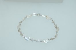 A 925 Italian silver bracelet with moon and star links and round claw clasp. marked 925.
