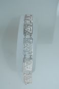 A 925 silver bracelet with abstract geometric filigree links with lobster claw clasp. Measures 7.