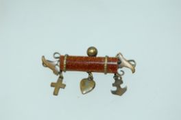 A late Victorian yellow metal brooch with central goldstone lozenge with charms for Faith Hope
