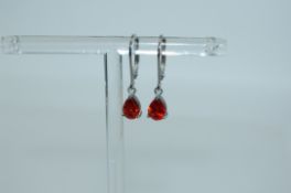 A pair of 925 silver earrings with teardrop shaped orange gem stone drops and lever backs. Weight 1.