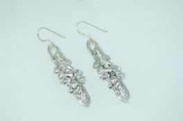 A pair of 925 silver Art Nouveau style earrings with fish hook backs. Measures 5cms. Weight 10g.
