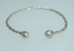 A 925 silver rope twist bangle bracelet with ball finials. Weight 10.