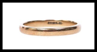A 9ct gold wedding band ring marked for Birmingham. Weight 2.1g. Size M.