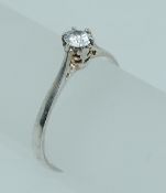 A 925 silver ring set with a solitaire clear round cut stone in a gallery setting. Size P. Weight 1.