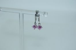 A pair of 925 silver earrings with pink gem stone drops and lever backs. Weight 1.5g.