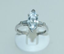 A silver ladies 925 stamped dress ring with central marquise CZ stone and baguette stone CZ