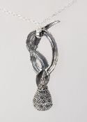 A 925 silver pendant necklace with large marcasite set snake pendant on a belcher link chain.