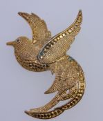 A good quality large vintage yellow metal brooch in the form of a bird of paradise . Roller clasp.