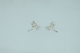 A pair of 925 silver earrings set with clear paste in the shape of dragonfly's with push post