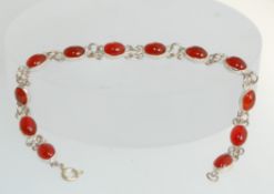 A 925 silver and amber style bracelet with oval link setting and round claw clasp stamped 925.