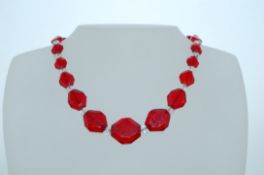A 1930s Art Deco Czech glass bead necklace with faceted red and button cut clear glass beads with