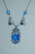 A 1950s white metal Czech necklace with filigree pendant decorted with filigree and blue glass