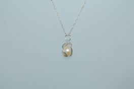 A 925 silver pendant necklace strung with a single freshwater pearl within a spiral cage on a fine