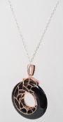 A 925 silver designer pendant necklace with large onyx pave set panther pendant with green stone