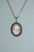 An early 20th century cameo pendant necklace of the Madonna with yellow metal bar chain and barrel