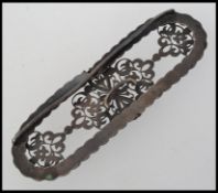 A late 19th Century French white metal belt buckle side with rope and foliate decoration. .