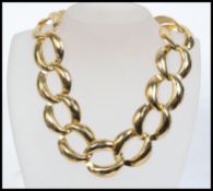 A vintage choker necklace made with planished yellow metal oversized belcher chain links with clip