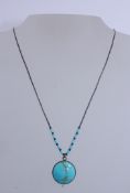 A 925 silver pendant necklace strung with silver and turquoise beads Marked 925 to chain.