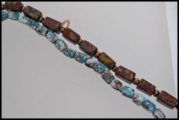 Two vintage Venetian glass bead necklaces strung with mottled glass beads one with screw barrel