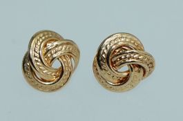 A pair of 9ct gold earrings in the form of a a celtic knot no backs. Weight .