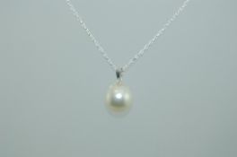 A 925 silver pendant necklace strung with a single freshwater pearl on a fine silver chain.