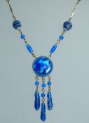 An early 20th century Art Nouveau Czech blue foil lined glass bead necklace with filigree spacers.
