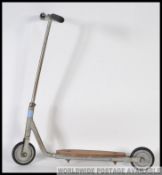 A vintage metal small childs scooter,