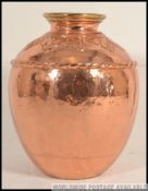 A very large 20th century heavy unusual hand beaten Arts and Crafts style copper / brass vase