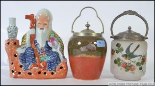 A Royal Doulton biscuit barrel together with a frosted glass and white metal biscuit barrel along