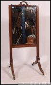 A stunning 19th century mahogany cheval mirror raised on splayed legs with central rise and fall