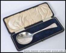 A large hallmarked silver spoon, within the original presentation case. L21cm 75.