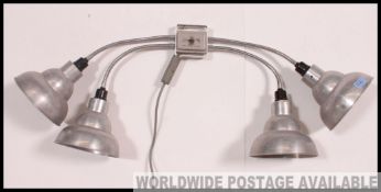 An excellent retro mid century wall mounted quadruple head anglepoise lamp.