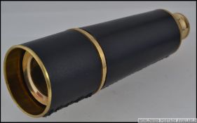 An antique style military leather cased three draw brass telescope