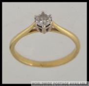 An 18ct gold and diamond single stone ring approx 50pnts, total weight 2.8g / Size Q.