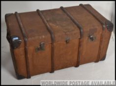 A good quality large early 20th century wooden and canvas bound steamer trunk.