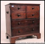 A 19th century Georgian mahogany commode / bachelors chest of drawers.