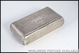 An early 20th century continental engine turned silver snuffbox being chase decorate.