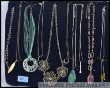 A tray of ten costume jewellery necklaces including white metal.