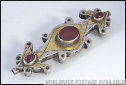 An unususal believed 19th century Turkman silver and partial gilt bead set necklace pendant with
