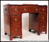 A 19th century Victorian mahogany twin pedestal campaign desk.
