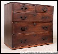 A Georgian mahogany chest of drawers with flared top over a bank of short and deep drawers having