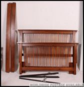 A good quality Arts & Crafts oak slatted double bed having flat top rails with lattice head and