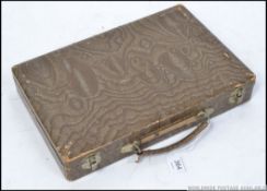 A mid century cased Mah Jong domino game set having bone and bamboo style tiles along with a