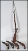 A group of four replica antique style flintlock pistols along with a replica flintlock rifle 108cm