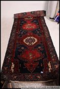 Large early to mid 20th century floor rug of geometric design, having a geometric border,