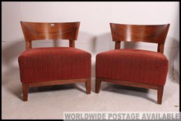 A pair of 1930's Art Deco style tub armchairs.